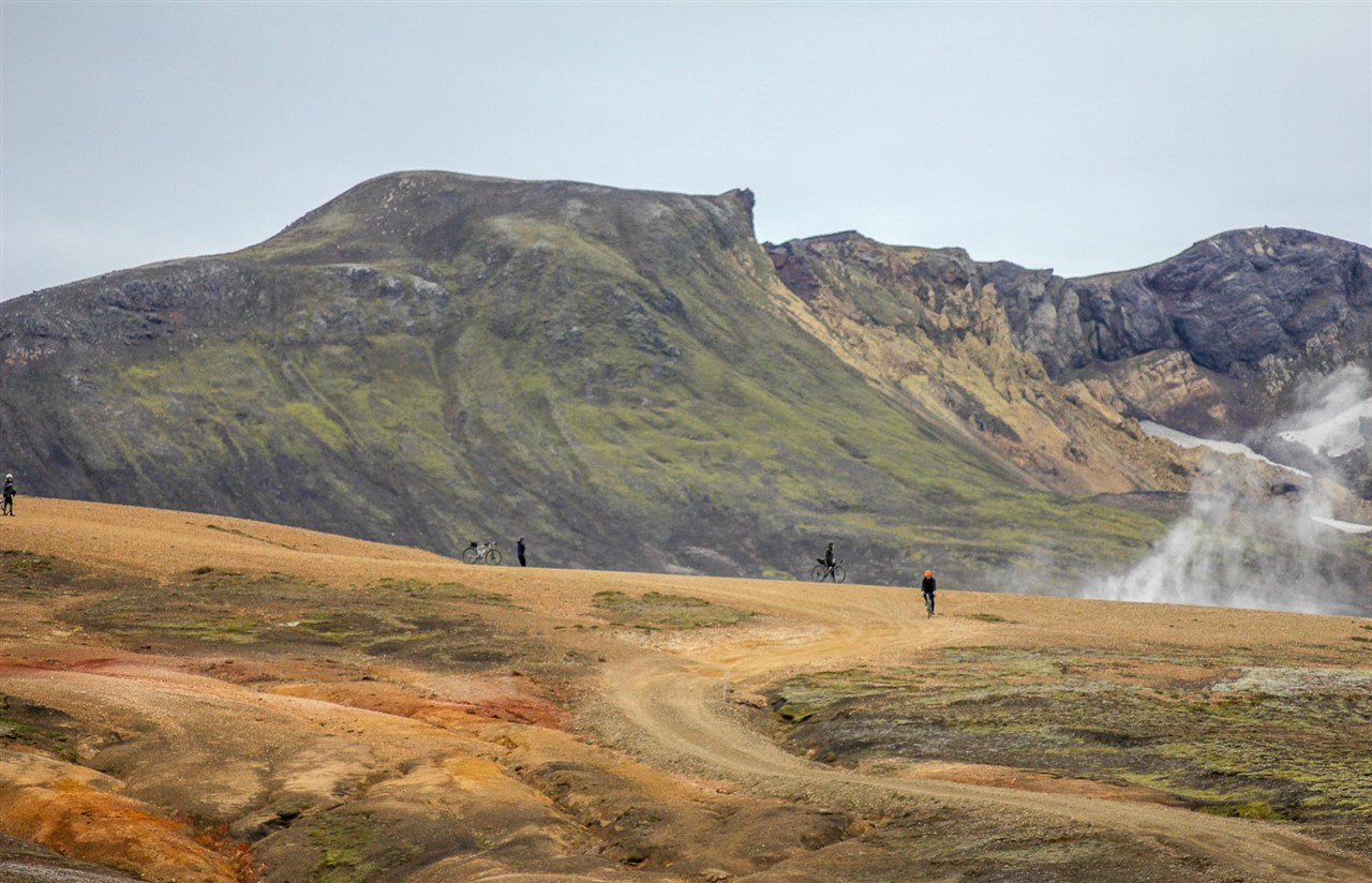https://icebike-c0a2.kxcdn.com/wp-content/uploads/2023/02/Gravel-riders-cycling-by-a-geothermal-area-in-Iceland.jpg