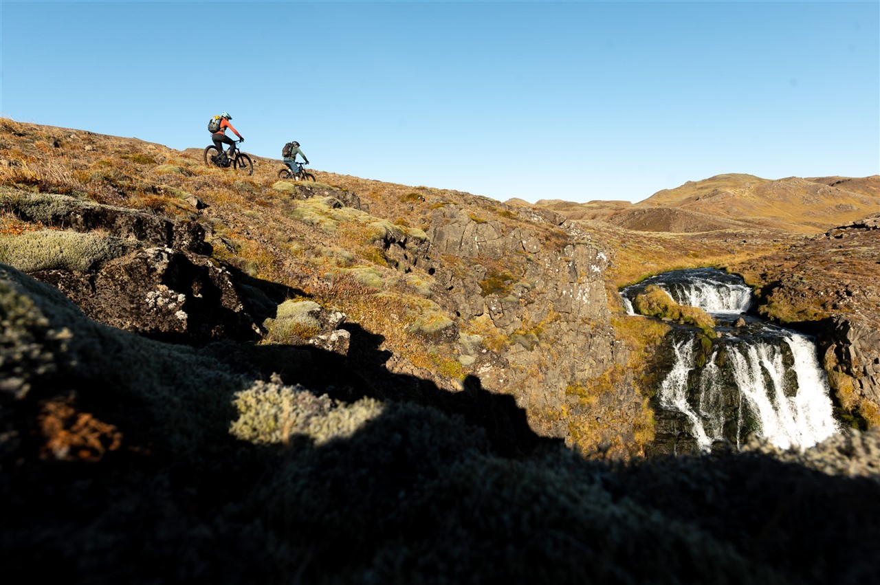 https://icebike-c0a2.kxcdn.com/wp-content/uploads/2023/02/One-of-the-epic-trails-of-Icebike-trailcenter-leads-you-to-the-top-of-this-waterfall.jpg