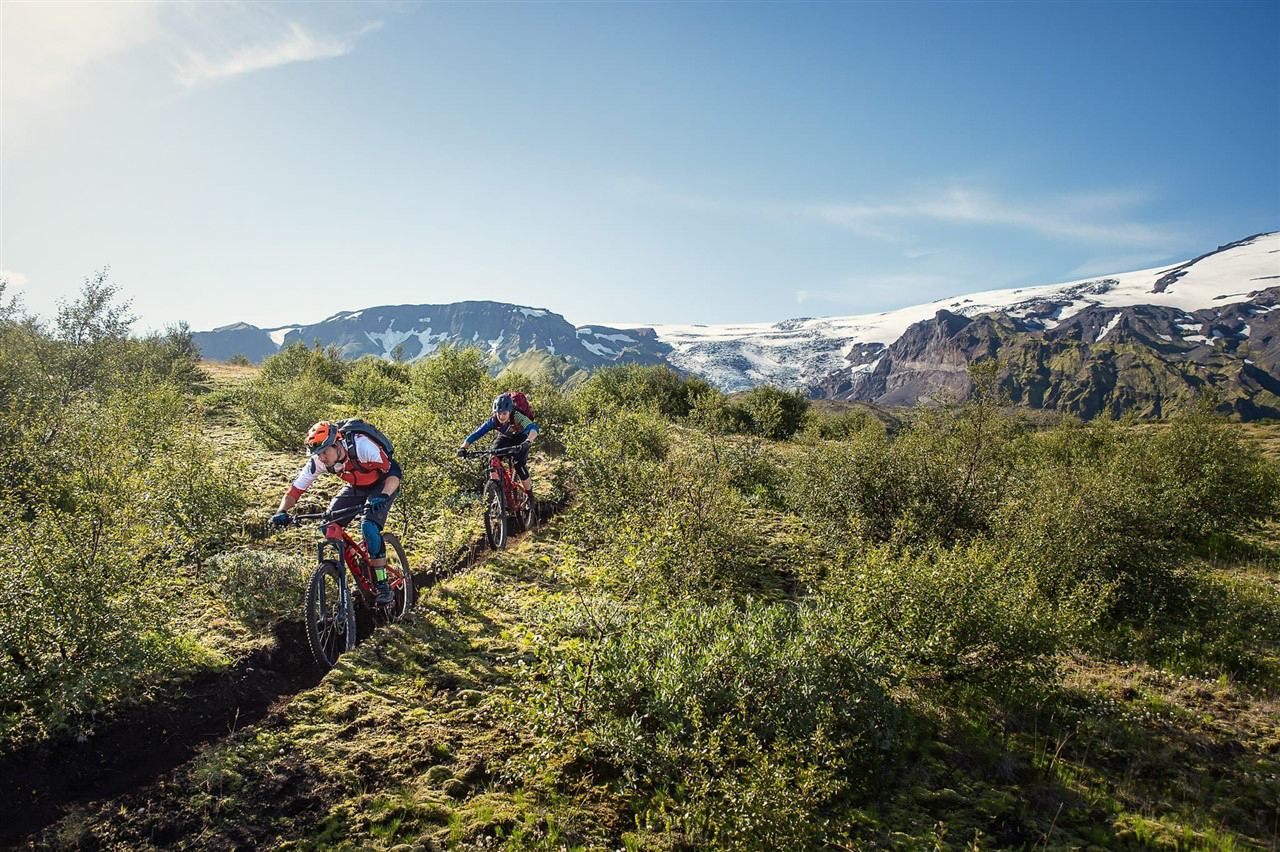 https://icebike-c0a2.kxcdn.com/wp-content/uploads/2023/02/Riding-the-Thor_s-garden-forests-surrounded-by-glaciers.jpg